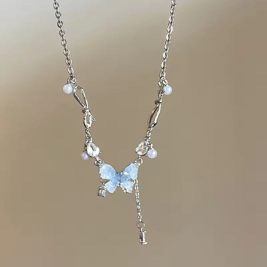 New arrival: Ice Crystal Gradient Pearl and Blue Zircon Butterfly Tassel Necklace. Elegance and grace, perfect as a gift.
